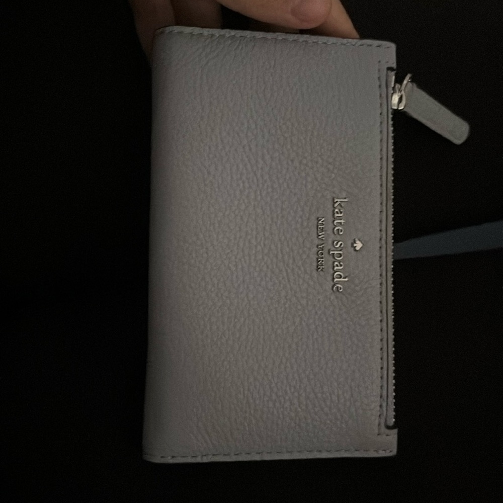 A baby blue Kate spade wallet